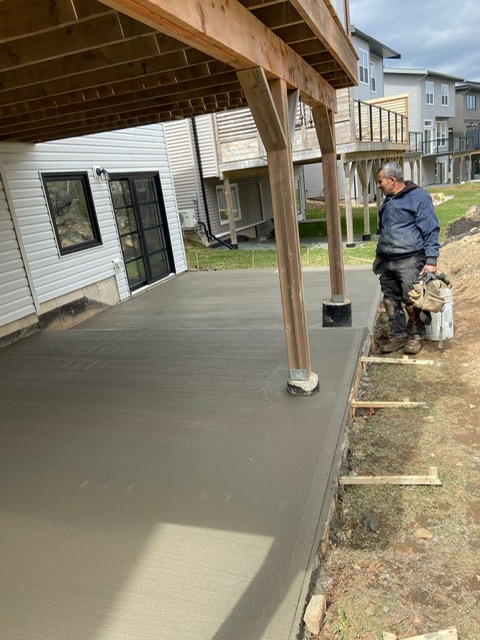 Concrete pour under residential deck by A2Z Creteworks