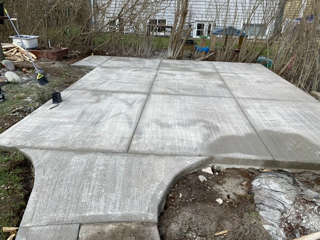 Elevated view of broom-finished concrete flatwork by A2Z Creteworks