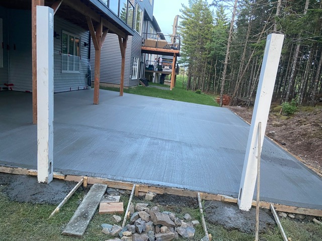 Wide-angle view of concrete patio pour with forms in place by A2Z Creteworks